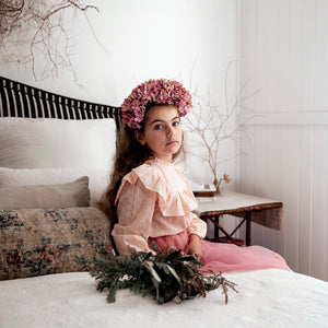 Side view of the Amelia Broderie Anglaise in blush pink