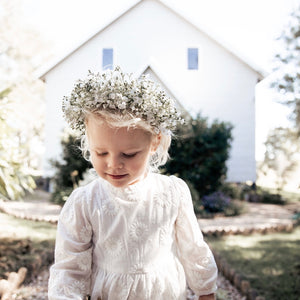 Close up of the Arabella Flower Girl Off White Romper