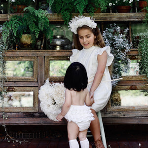 Ivory ruffle romper with matching Madeleine flower girl dress