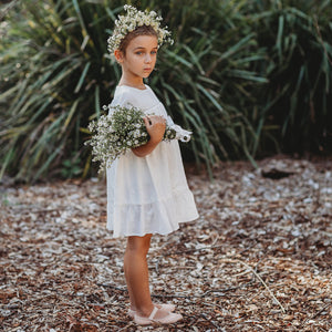 Side view of Mariposa ivory flower girl dress