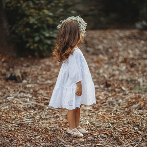 TODDLER FLOWER GIRL DRESS IN WHITE BRODERIE ANGLAISE SIDE VIEW