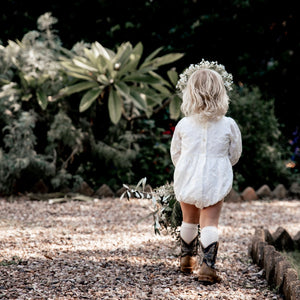 Button detail of the long sleeve ivory marguerite playsuit