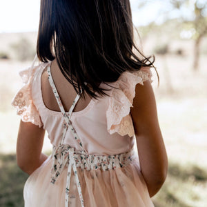DETAILS OF LACED-UP TUTU SKIRT IN PALE PINK BY AUBRIE