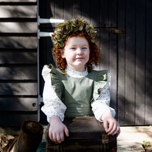 Ruffle Bib Puck Playsuit in Pistachio green