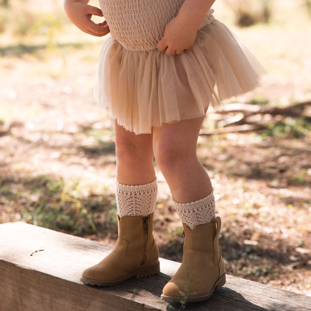 Little girl deals boot socks