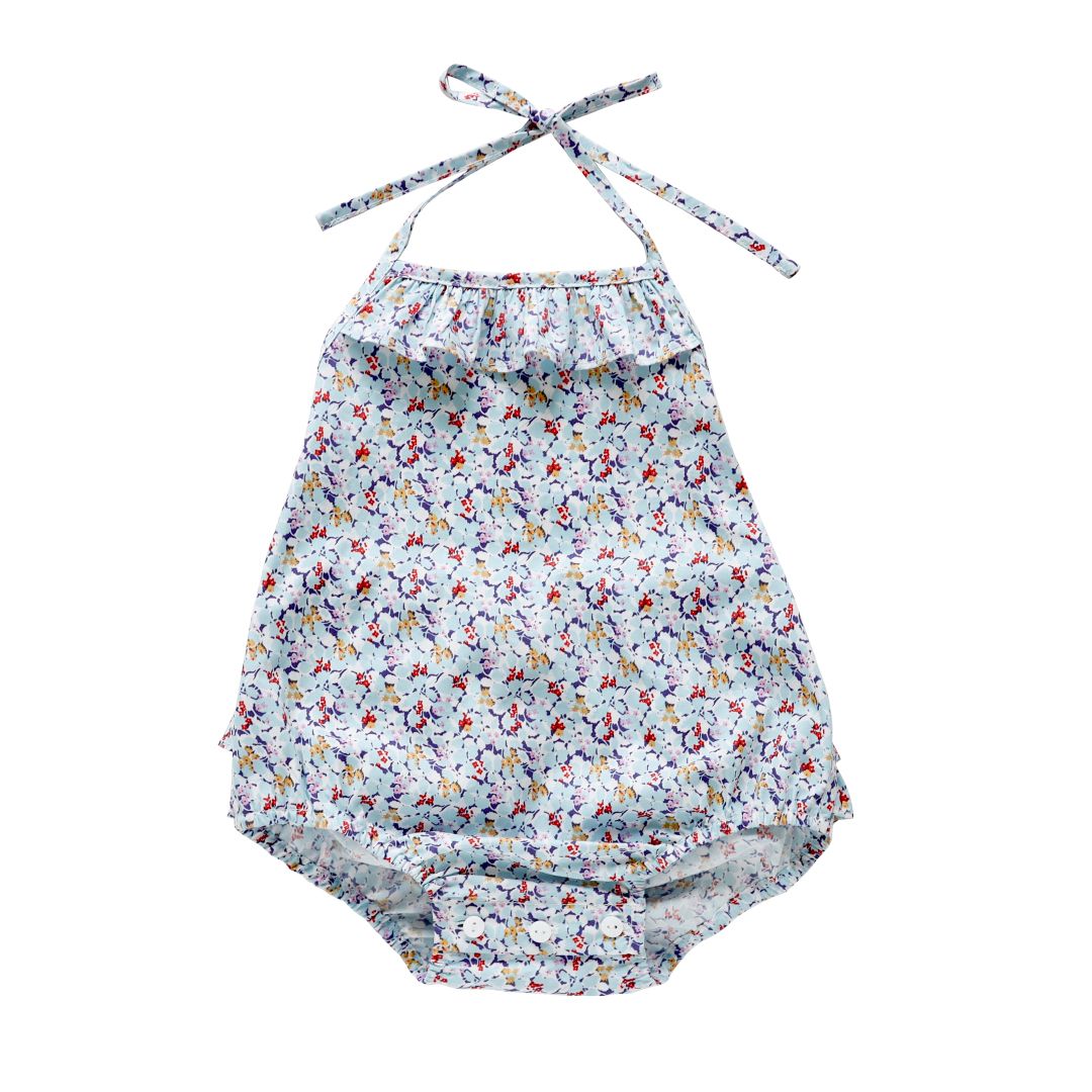 Sideview of the the duck egg blue floral toddler romper
