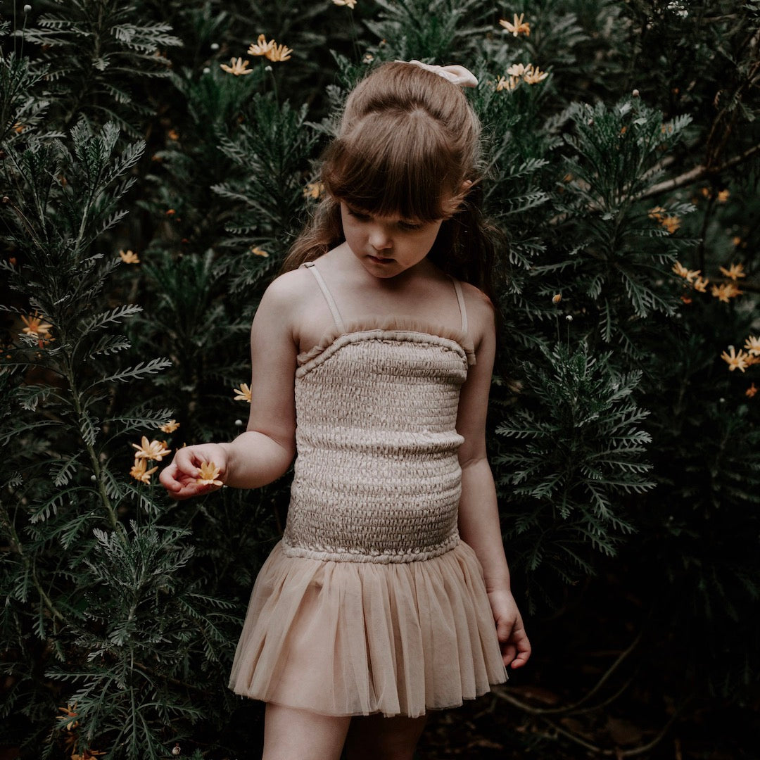 Tulle edge detail of pirouette playsuit in antique cream