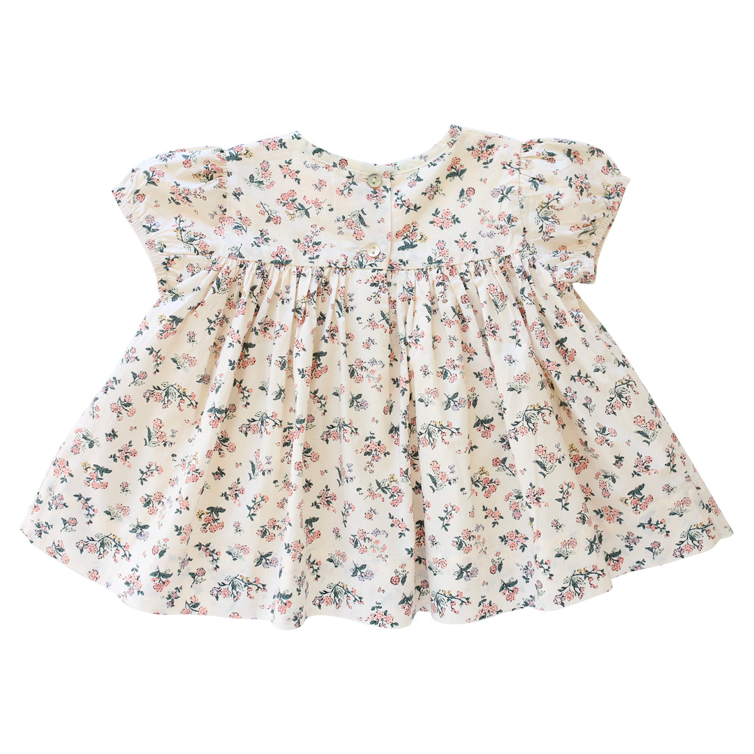 Button back detail of pink Primrose smock by AUBRIE